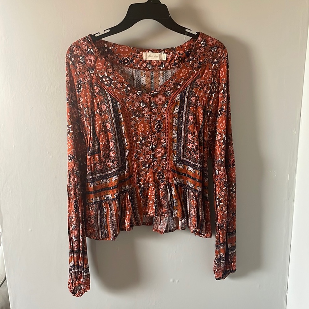 Burnt orange and navy blouse